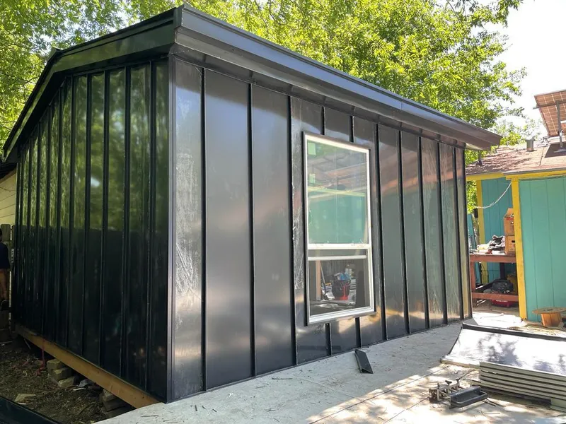 Black standing seam metal wall panels for Roof Inspection in Slinger